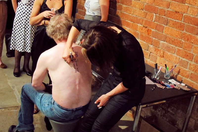 Queueing up while Nigel gets pen tattooed during Agent Provocateur at Anna Pappas Gallery, Melbourne 2012