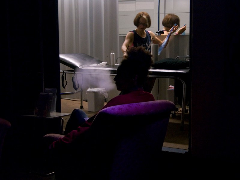 After 12 hours, Stellmach preps for her last consultation of the day, Berlin Festival, photo by Boris Eldagsen